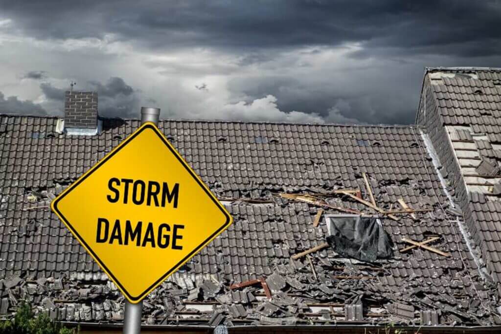 A storm damage sign on a South Florida roof is surrounded by debris from the recent storm. 